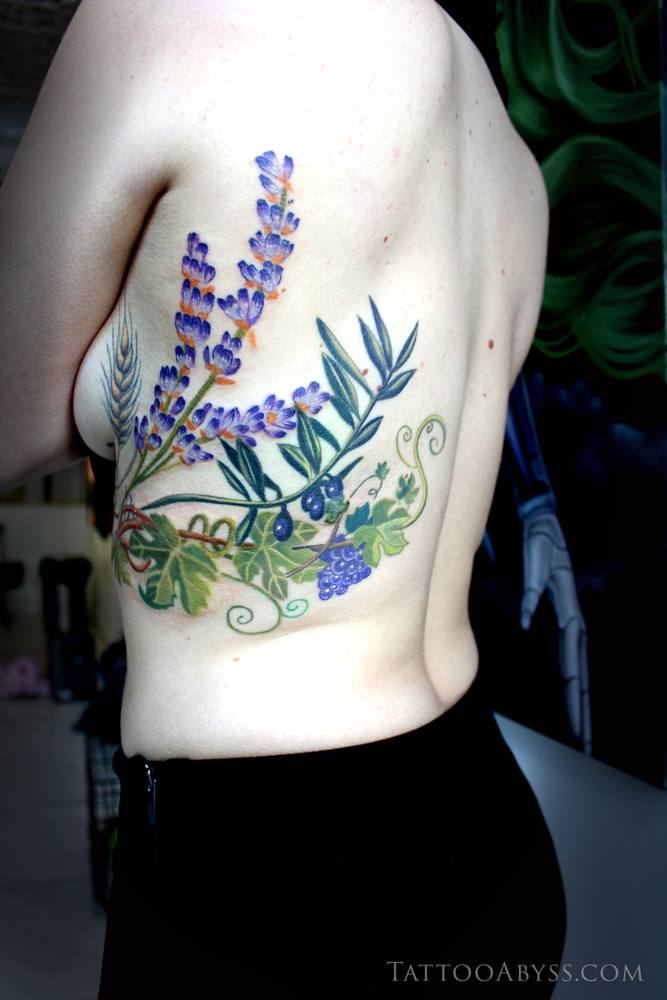 Fine line flowers tattoo on the rib
