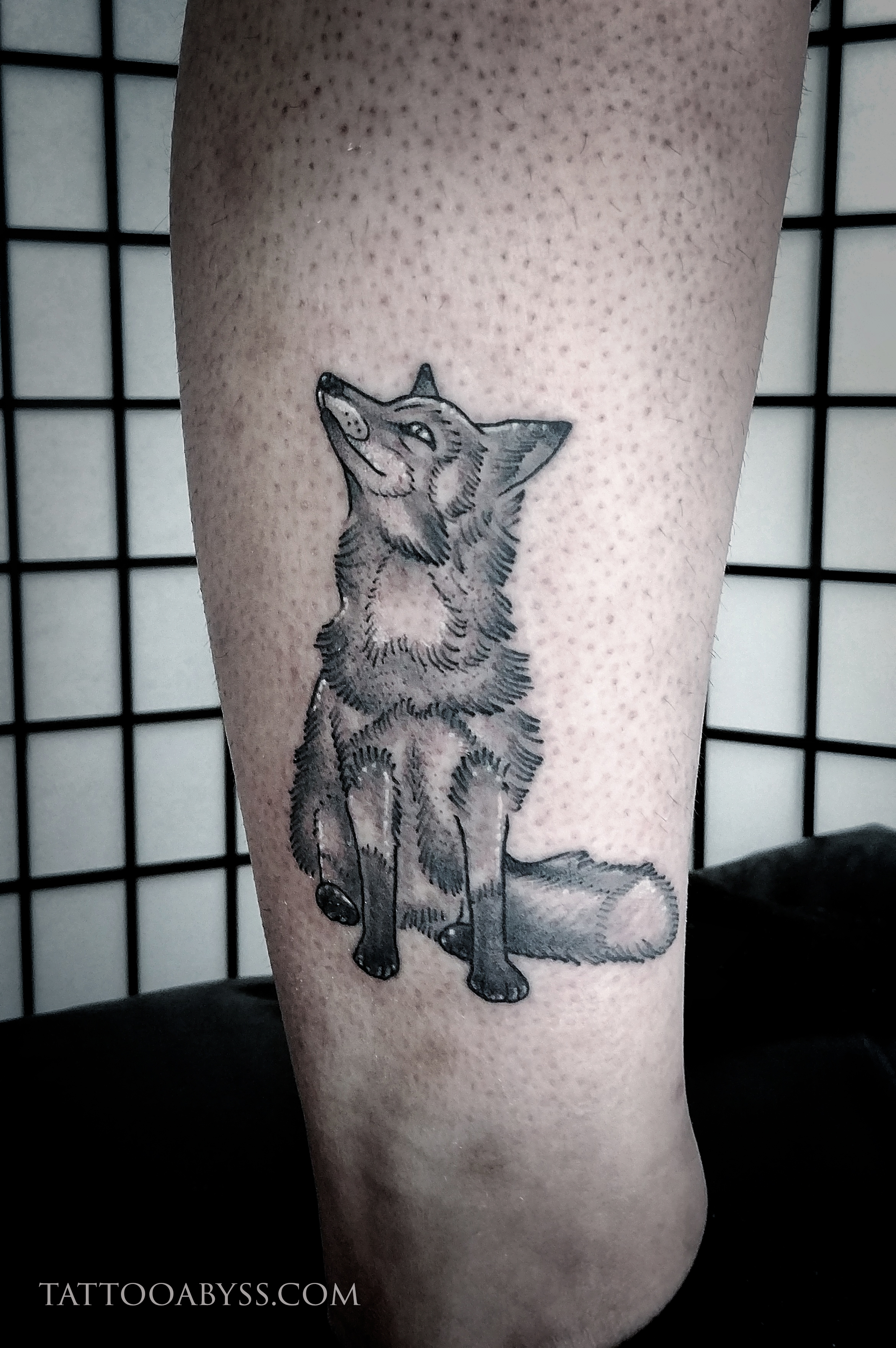 sitting howling wolf tattoos