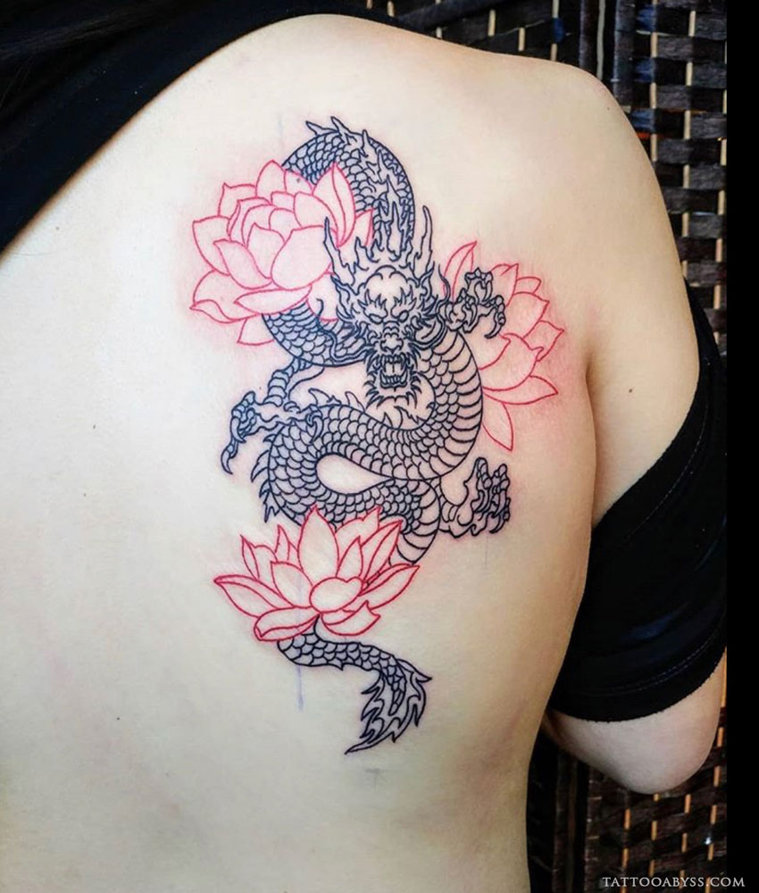Dragon and flower tattoo located on the leg blackwork