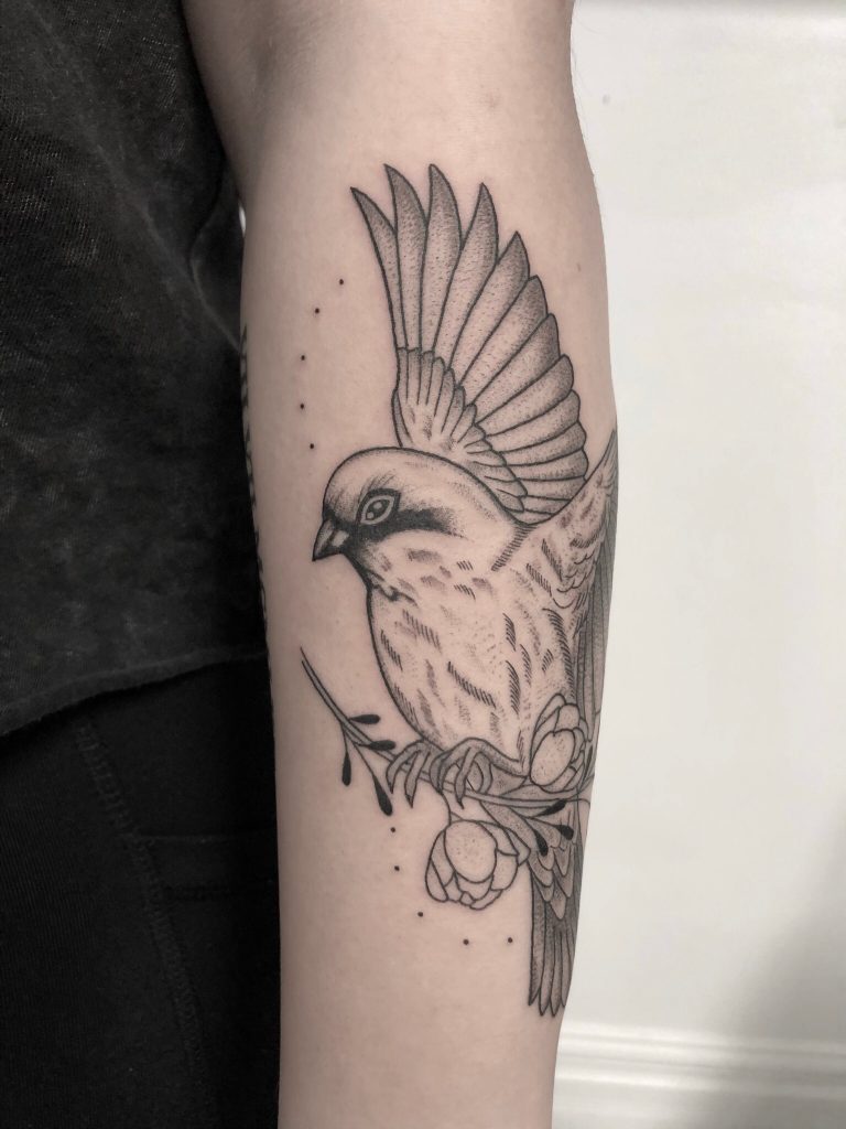 flying-bird-with-flowers-tattoo
