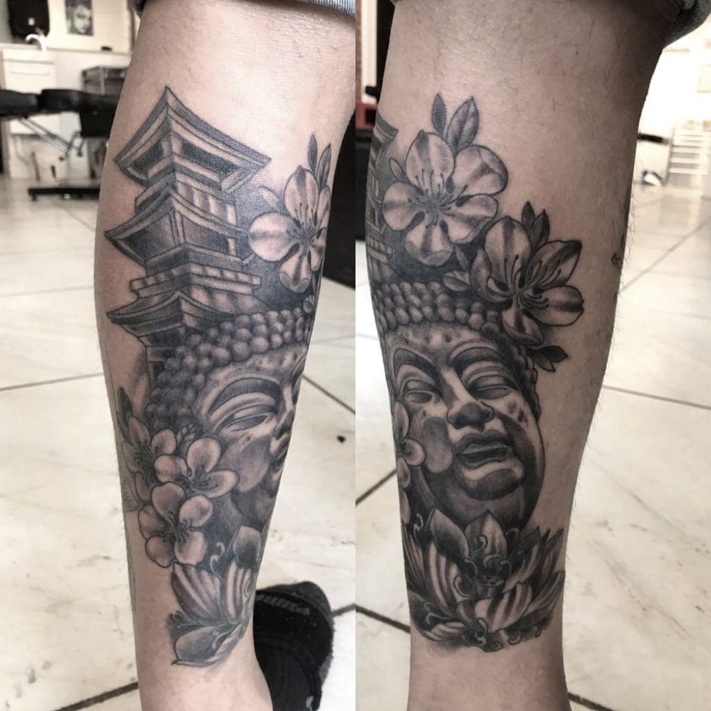 Buddah-Head-with Temple-and-flowers-tattoo