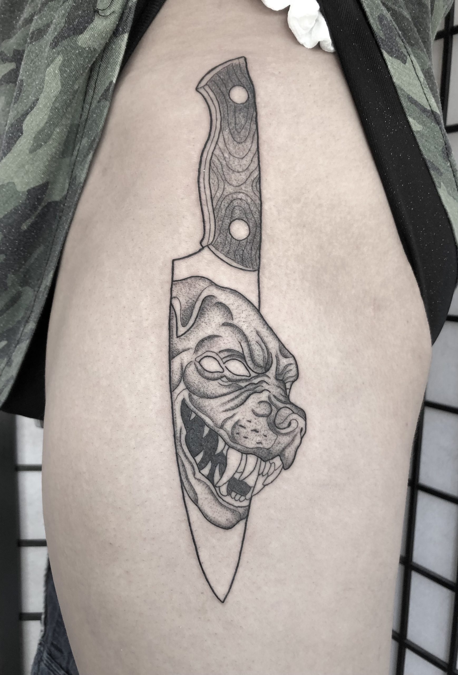 knife-with-demon-dog-tattoo