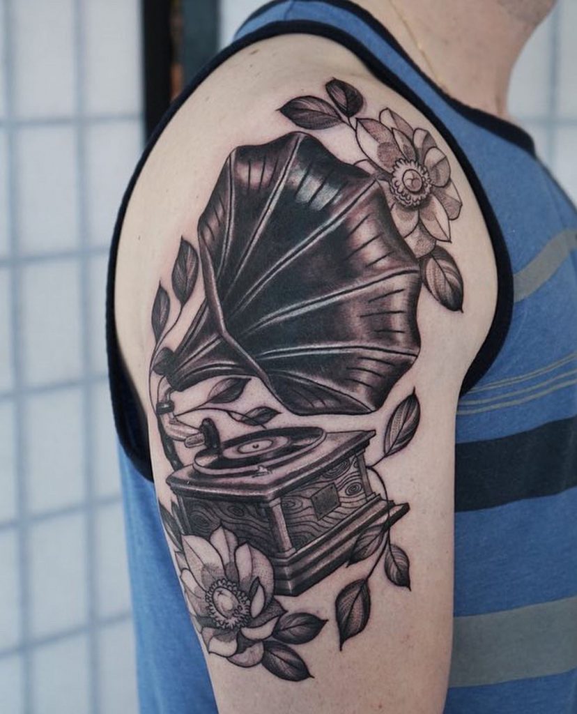 Traditional style gramophone tattoo located on the