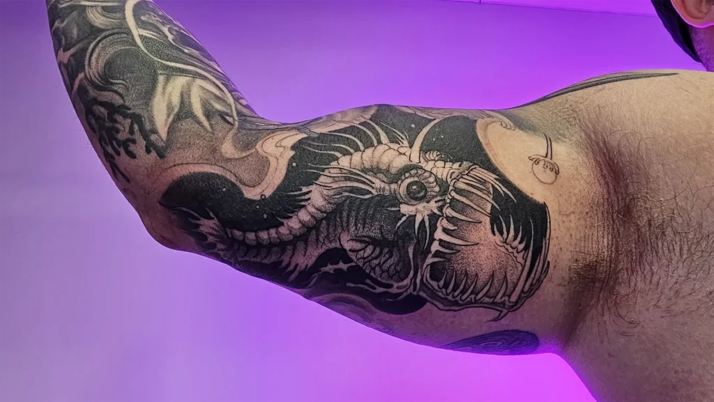 Angler tattoo created at tattoo Abyss in Montreal