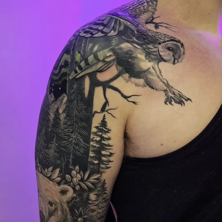 Realistic owl and forest sleeve tattoo by Montreal tattoo artist at Tattoo Abyss