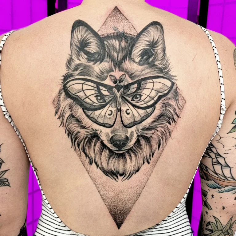 Black and grey wolf and moth back tattoo cover-up with geometric dotwork by Abby – Montreal tattoo artist
