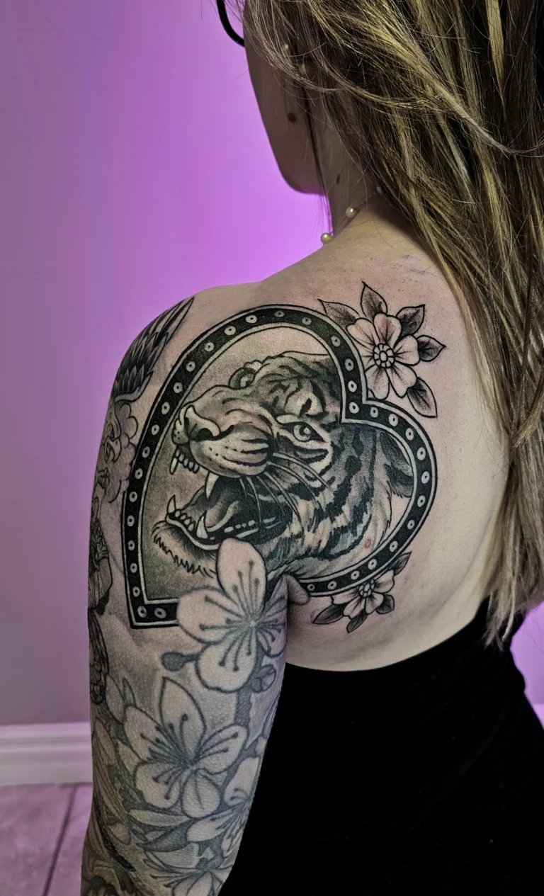 Tiger tattoo covering an old cloud and cupcake tattoo