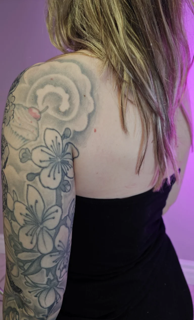 Old cloud and cupcake tattoo before tiger cover-up